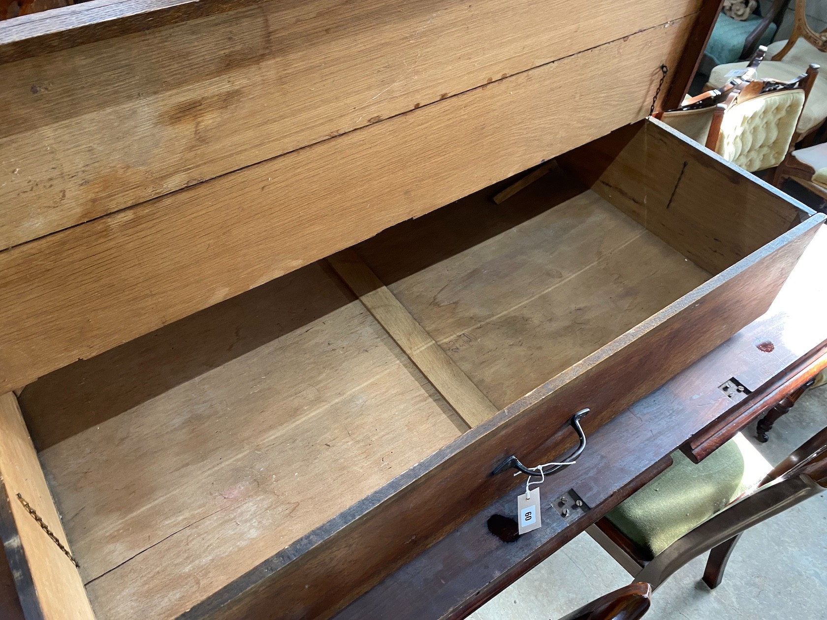 An oak under-bed storage box on wheels, length 123cm, depth 62cm, height 26cm